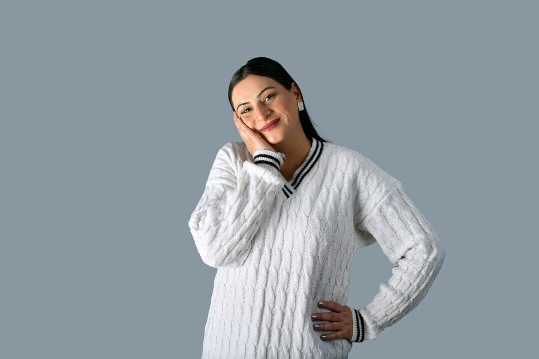 Studio portrait of a smiling finance advisor woman