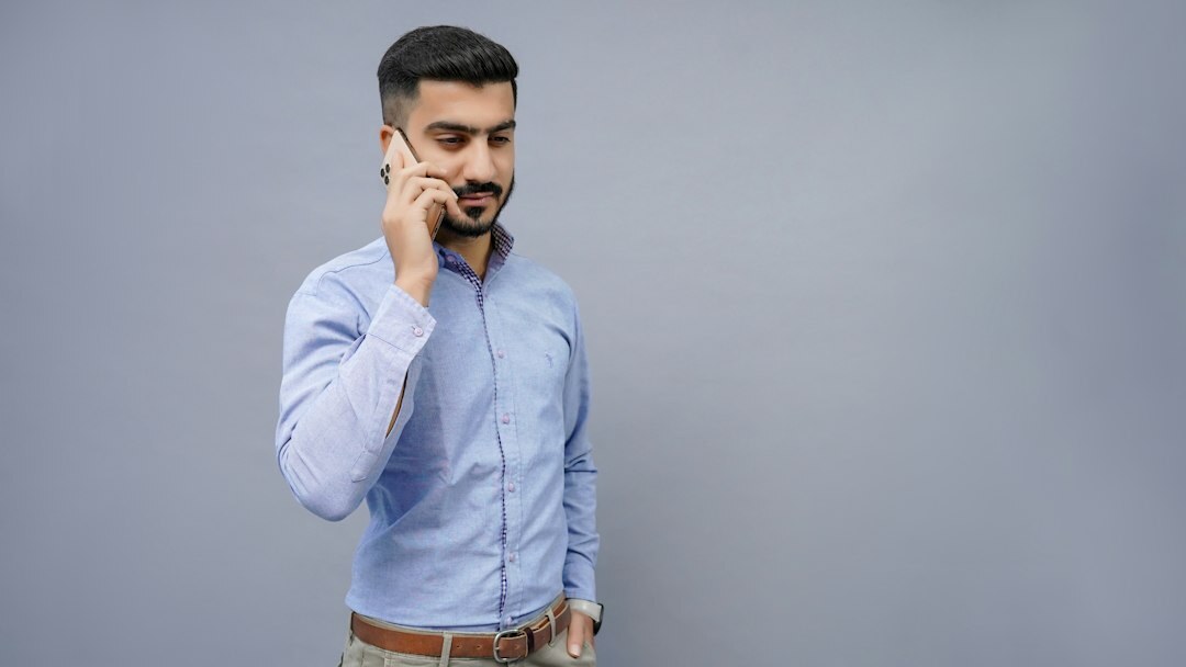 Studio portrait of a friendly customer support specialist man