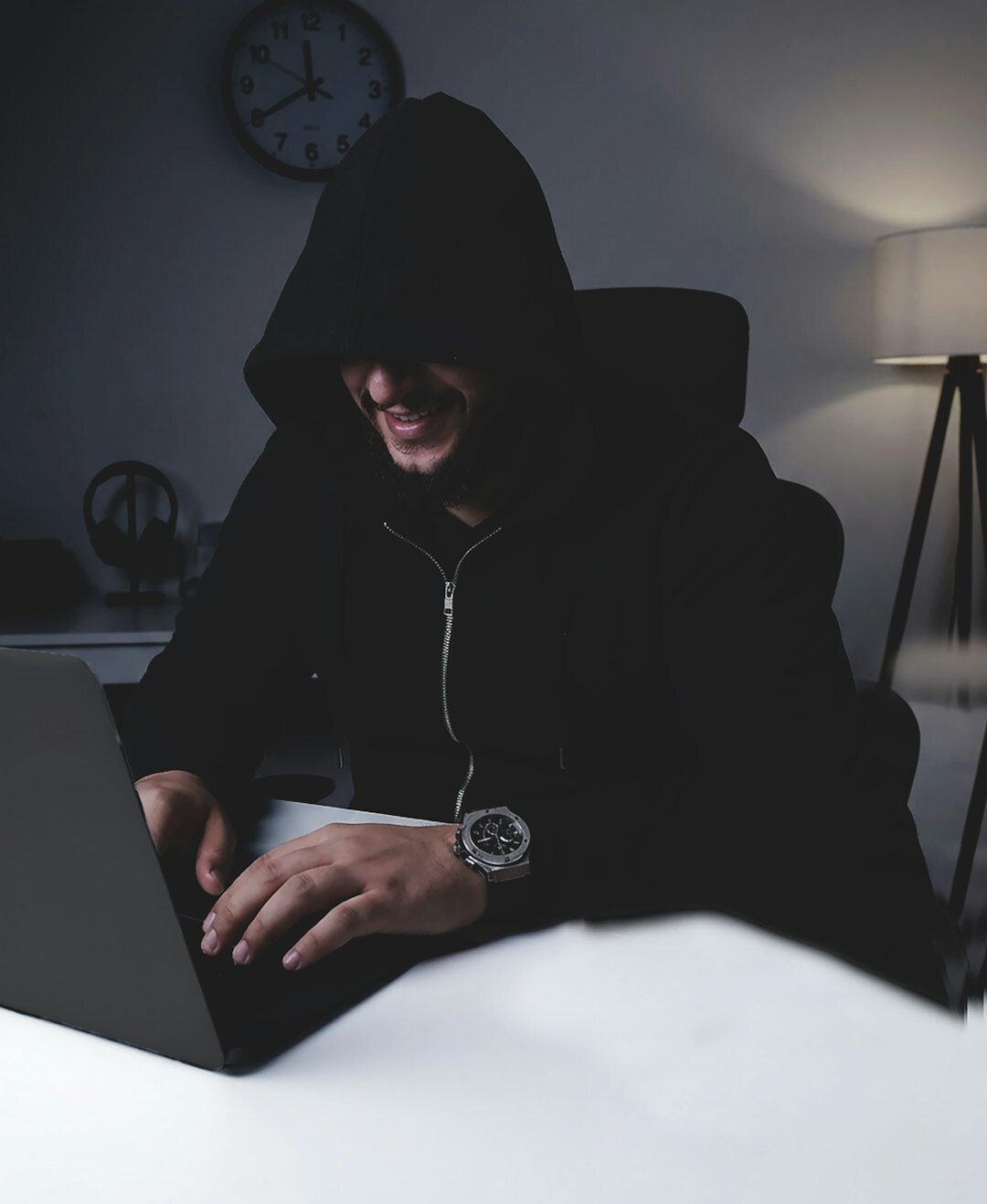 programmer coding on laptop