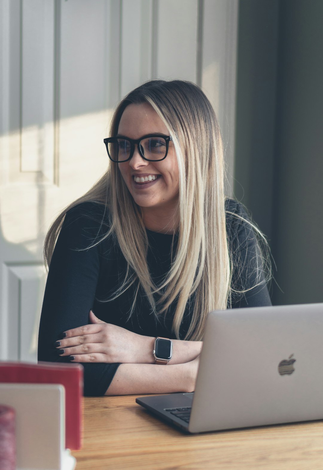 woman smiling while coding
