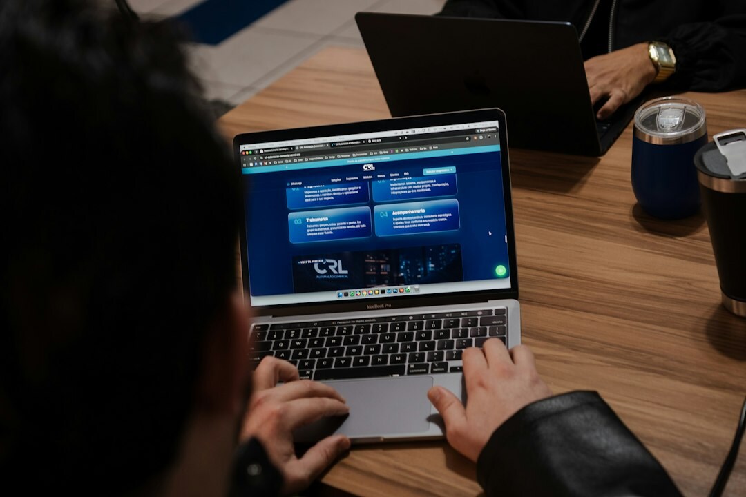 student coding on laptop
